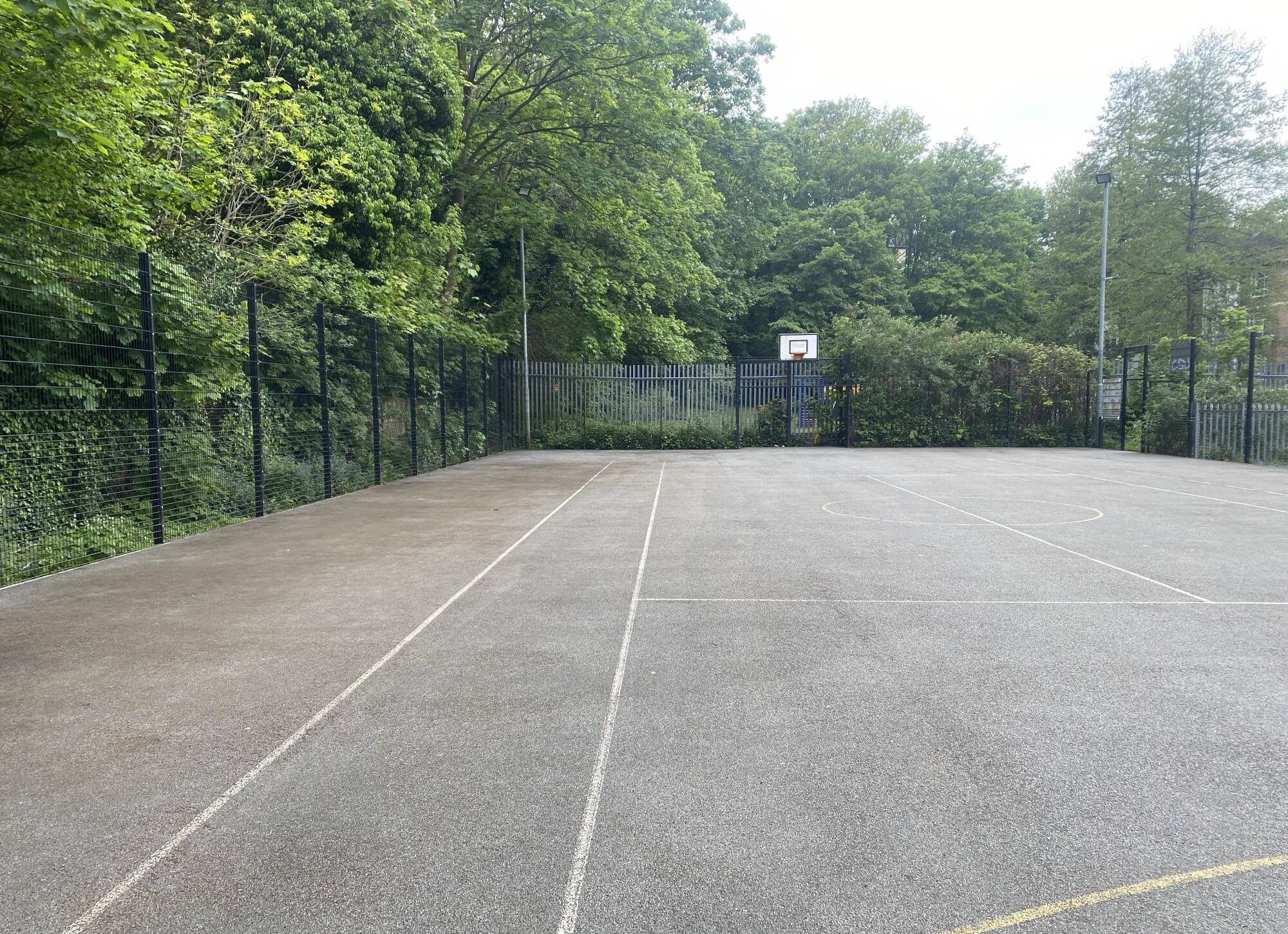 Professional jet washing for Reigate sports court.