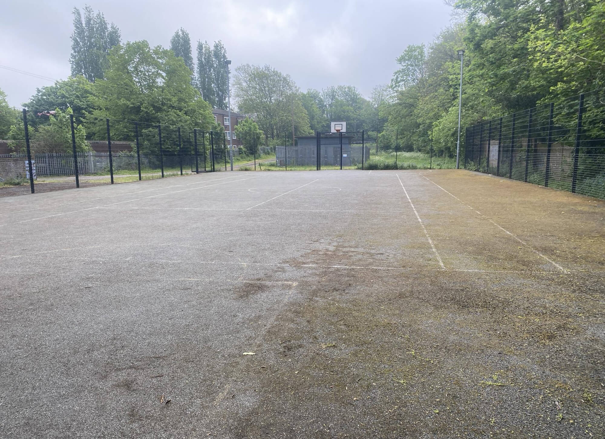 Professional exterior cleaning on a basketball court in Reigate.